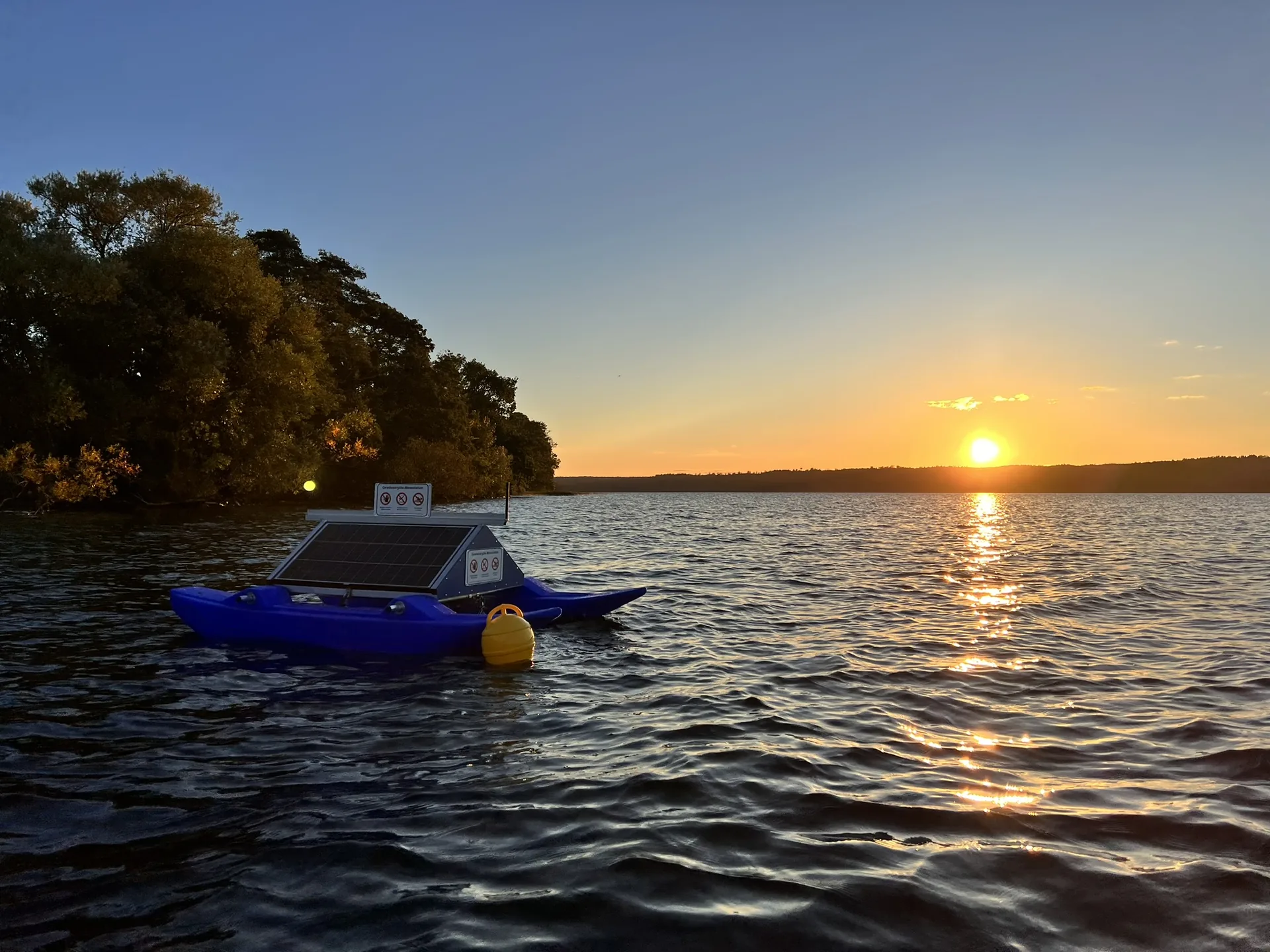 WAMO 220 in operation on a lake at sunset