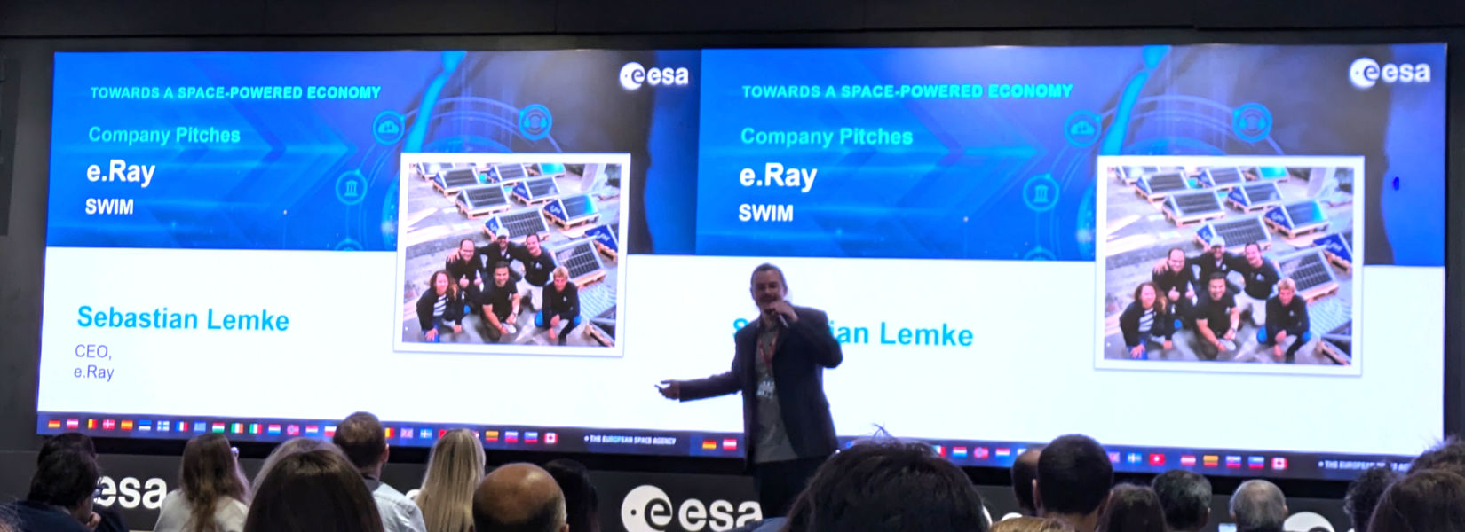 Sebastian Lemke presenting SWIM on stage at an ESA event